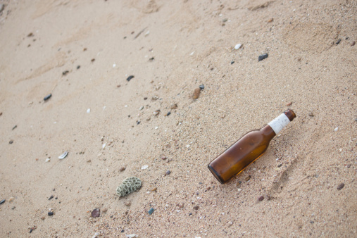 Bottles of beer on the beach.