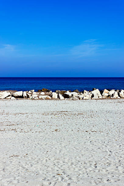 istock White sand, rocks, blue sea and sky 177380861