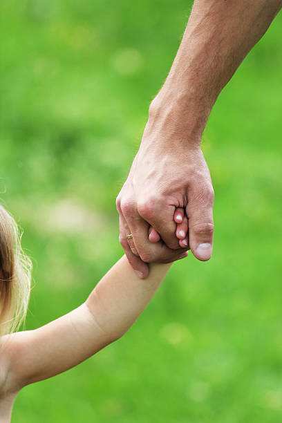 istock two arms of parent and child 177380972