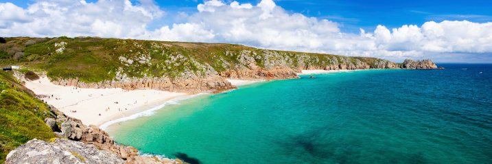 Panoramic view of Porthcurno Beach and Treen Cliffs from the coastpath near the Minack Cornwall England UK