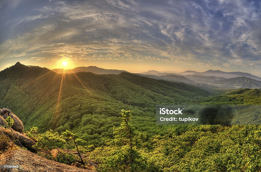 Fish-eye view of majestic sunset in Russian Primorye mountains Fish-eye view of majestic sunset of the Russian Primorye mountains landscape HDR image Autumn Stock Photo