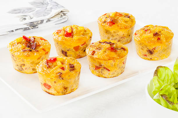 Six mini frittatas served on white dish  Mini frittatas on a platter. frittata stock pictures, royalty-free photos & images