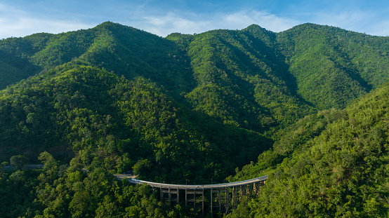 Aerial view of bridge, car, mountain forest, Landscape with beautiful road, Bridge and the road over the mountain.