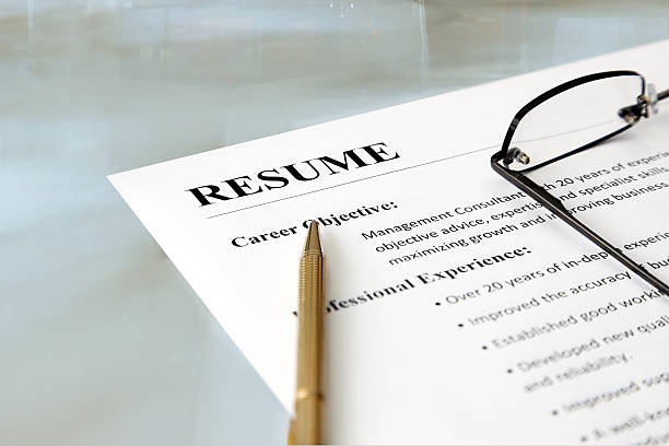 istock A person's resume spectacles and pencil on a table 177383487