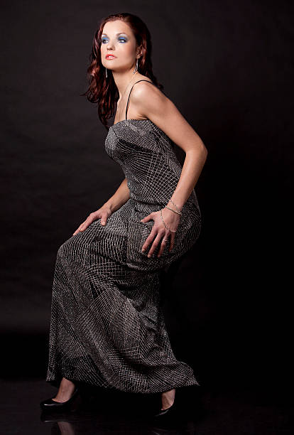 istock brunette in long dress 177383649