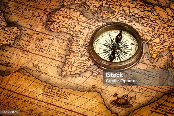 Old Vintage Compass On Ancient Map Stock Photo - Download Image Now - Navigational Compass, Ancient, Antique