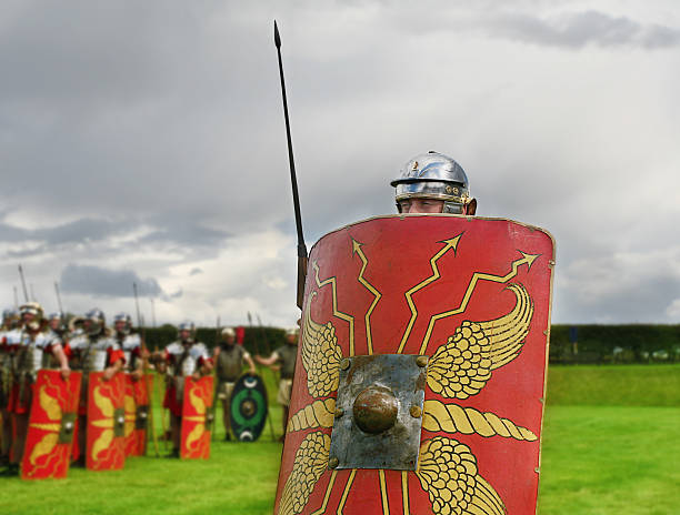 Out Of Line "Roman Soldier peers over shield,please see other Roman Soldiers from my Porfolio" roman centurion stock pictures, royalty-free photos & images