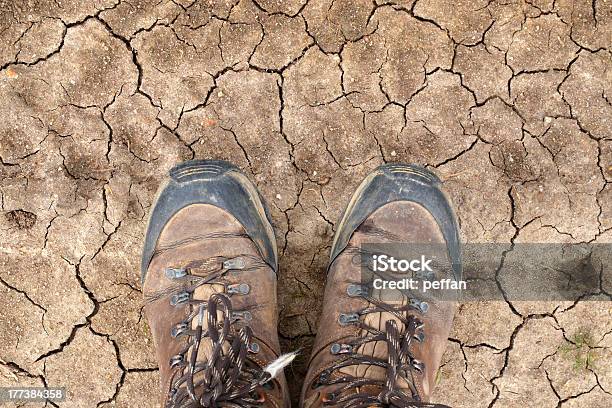 Hiking Boots On Dry Desert Soil Stock Photo - Download Image Now - Hiking Boot, Desert Area, Camino De Santiago