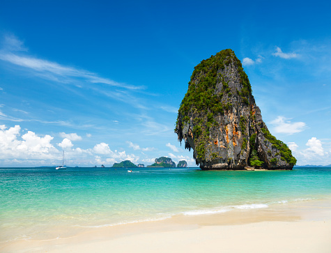 Fantastic tropical beach with white sand and karst rock in sea. Krabi, Thailand