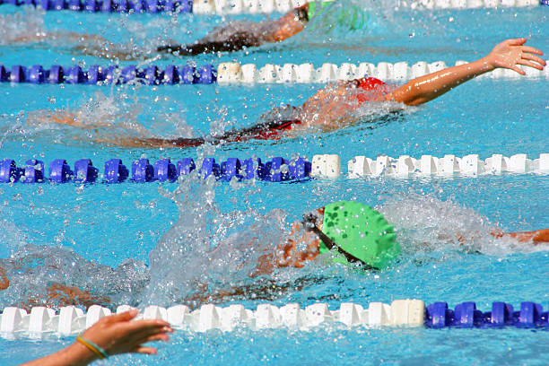 Backstroke swimmers in a close race