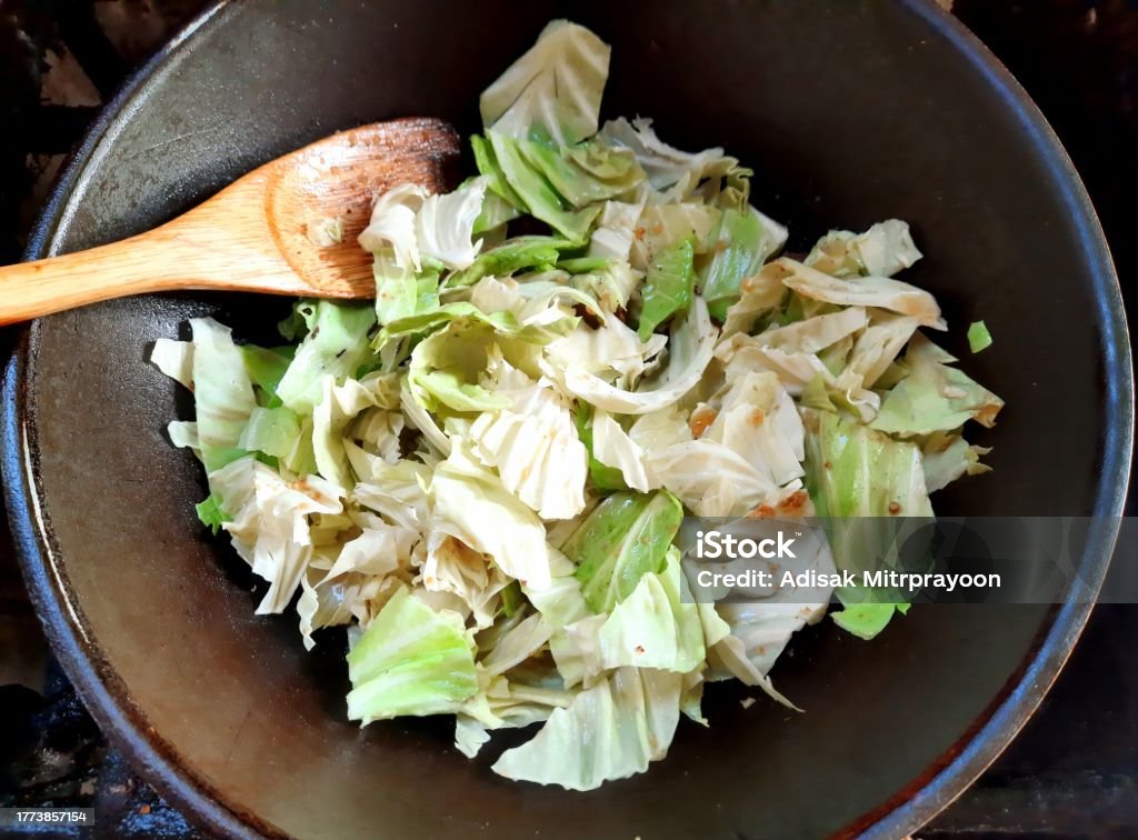 Cooking Stir fried Cabbage - food preparation. Cabbage Stock Photo