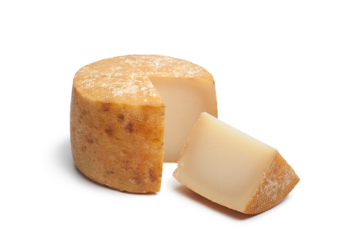 Traditional Basque sheep's milk cheese on white background
