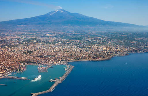 Air photo of Catania city in Sicily with the Etna Vulcan in the back.