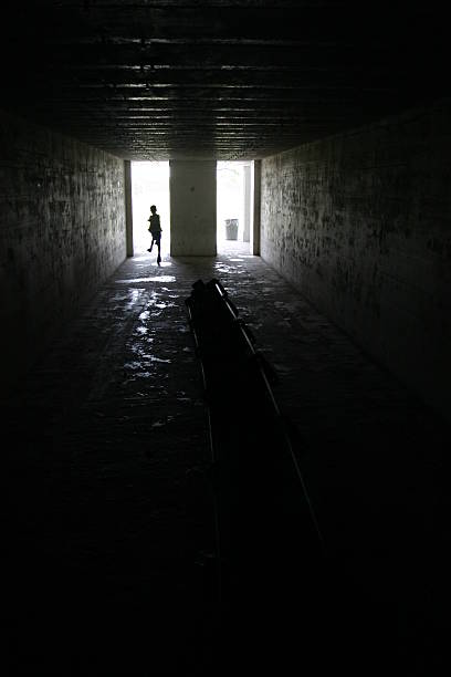 istock Child running in dark room 177387223