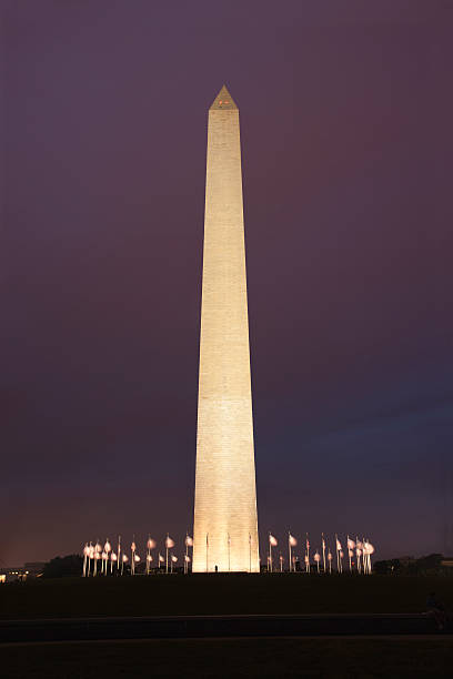 istock Night shot of Washington Monument with flags flying at base 177387406
