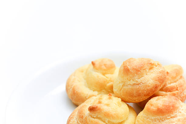 Cream puff on White Plate stock photo