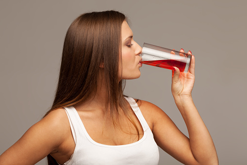 Girl drinking juice from glass
