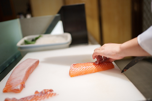 processing salmon, slicing salmon