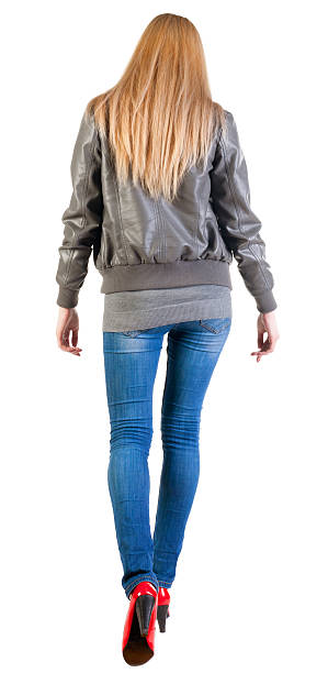 istock back view of walking woman 177389711