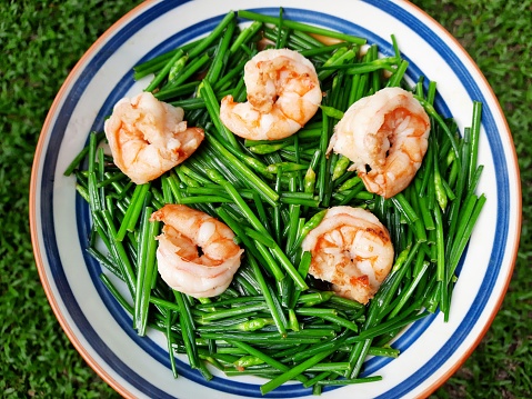 Cooking Stir fried Chinese Chives with shrimps - food preparation.