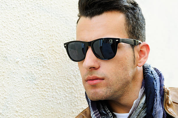 istock Attractive man with tinted sunglasses in urban background 177389829