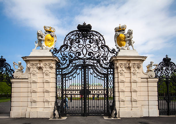 Scene Of Belvedere Palace Entrance Gate, People Walking Around, Tree And Sky On A Beautiful Day During The Autumn Season In City Of City Vienna Austria Europe