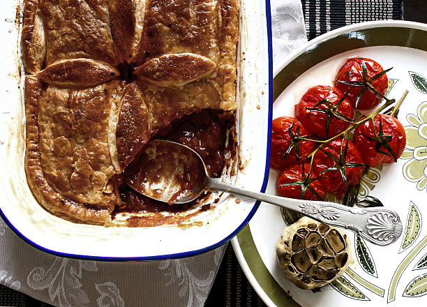 Hearty meat pie with roasted garlic & cherry tomatoes