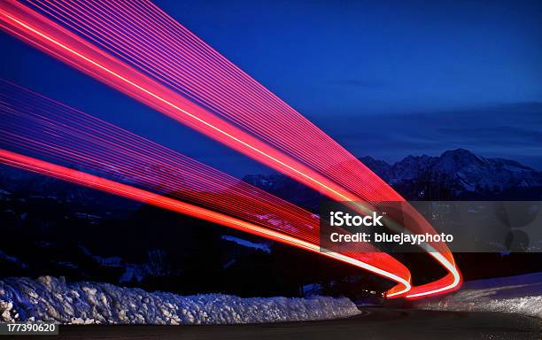 Light Trails On A Highway Stock Photo - Download Image Now - Headlight, Light Trail, Dirt Road