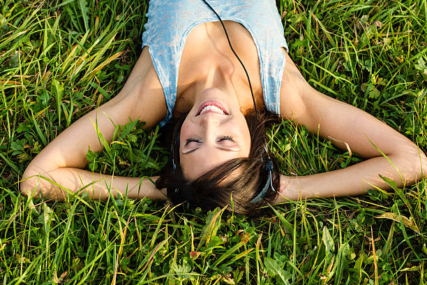 istock relaxing woman in meadow 177390937