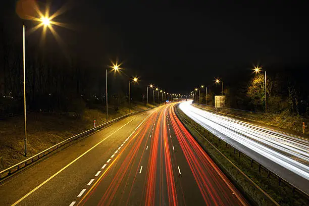 "The M6 motorway at night as it passes through Lancashire, England."