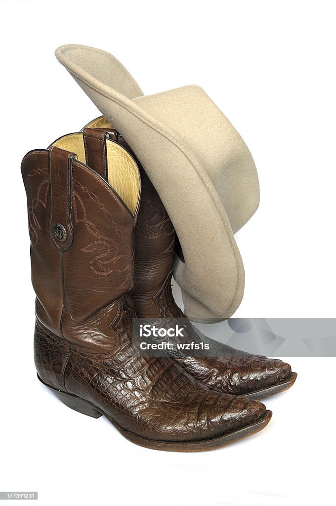 Botas de cowboy e marrom Chapéu de feltro em fundo branco - Royalty-free Bota de Cowboy Foto de stock