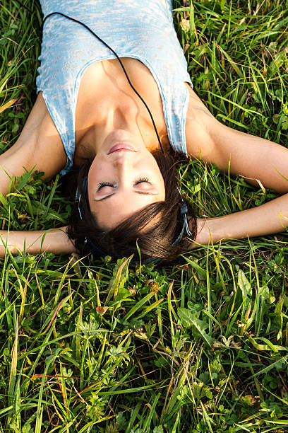 istock relaxing woman in meadow 177391381