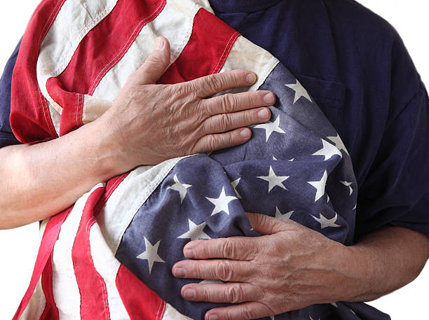 istock USA flag held by a veteran 177392099