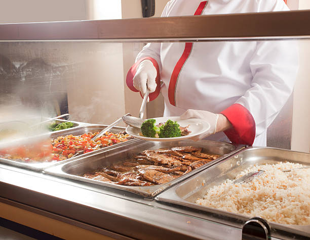 lunch service station chef standing behind full lunch service station cafeteria photos stock pictures, royalty-free photos & images