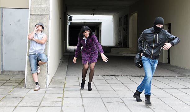 istock Daylight robbery on the street. Thief steals a bag. 177394387