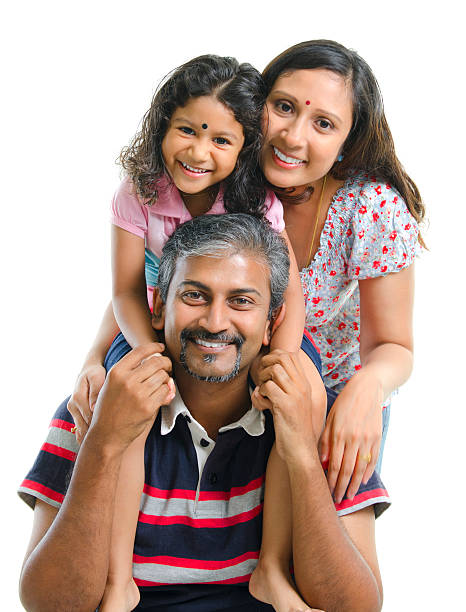Happy Asian Indian family Happy Asian Indian family stacking on white background cheerful little indian girl sitting with colors isolated on white stock pictures, royalty-free photos & images