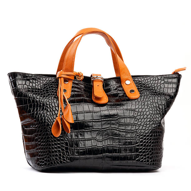 istock Black female bag with orange handles isolated over white 177394478