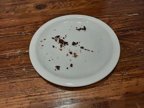 Rectangular white plate with chocolate stains with a fork on it