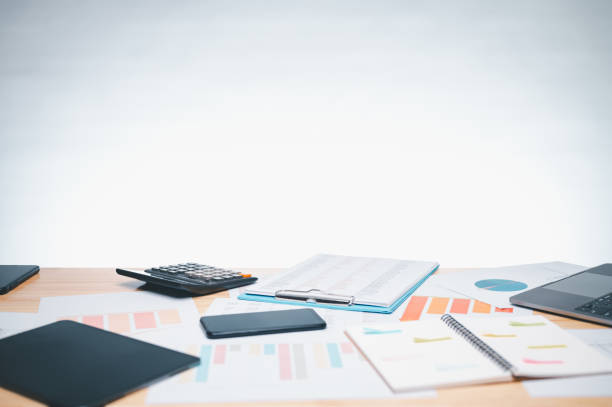istock The busy office desk is cluttered with documents, paperwork, and a laptop, symbolizing the bustling business environment where essential information is processed and reports are prepared in workplace 1773950918