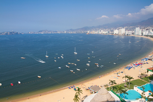 huge bay of hotels stretching along the coast in acapulco, mexico