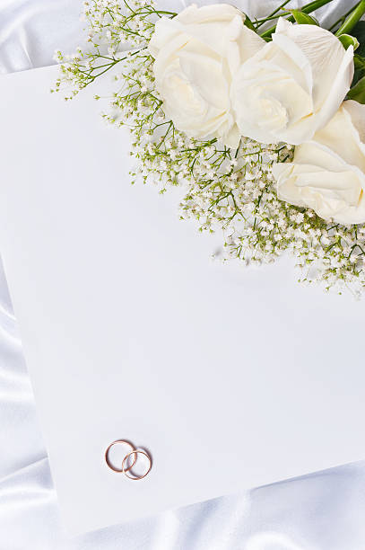 istock Wedding rings with a roses and invitation 177396296