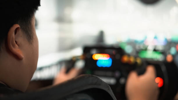 Young asian man playingCar racing video game.