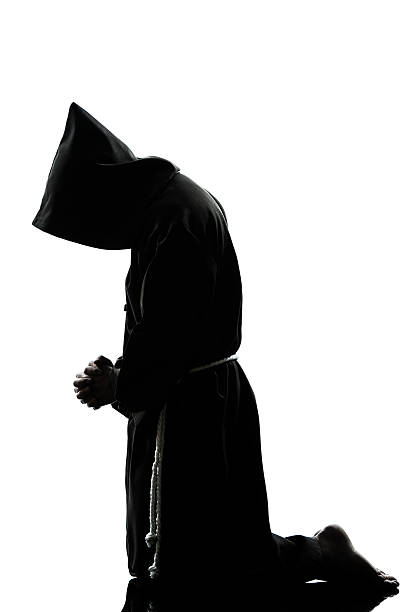 istock man monk priest silhouette praying 177399124