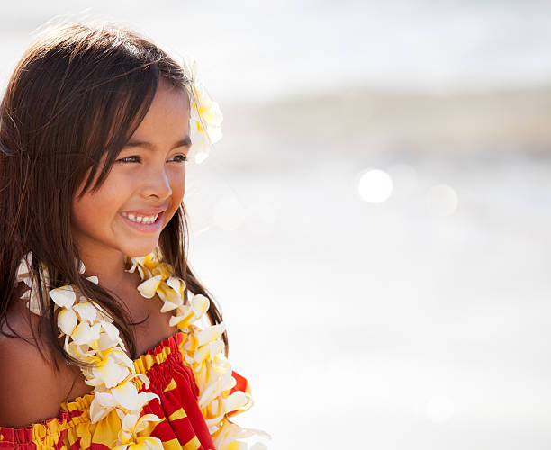 Pretty young girl smiling Pretty Hula Girl  at the beach wearing a handmade flower lei hula dancing stock pictures, royalty-free photos & images