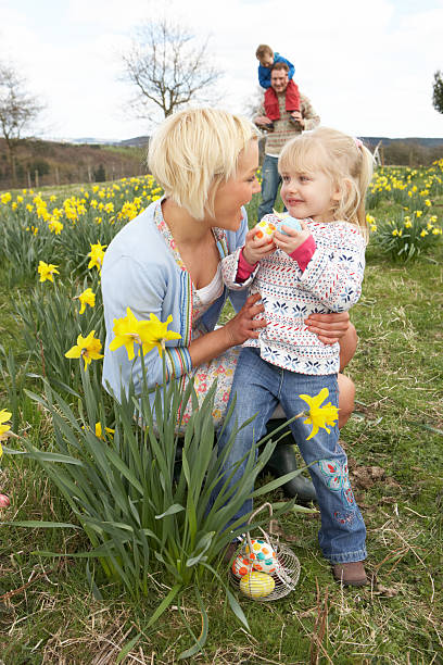 istock Family On Easter Egg Hunt In Daffodil Field 177399446