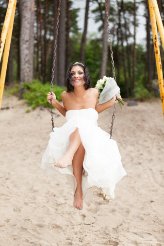 Runaway bride on a swing