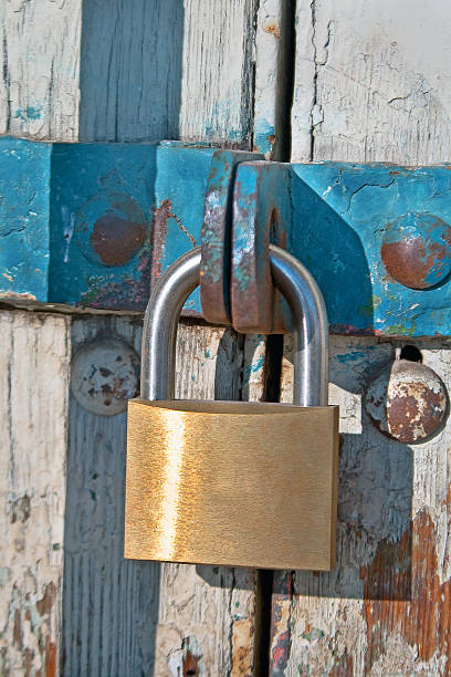 istock Padlock on old wooden door 177399674