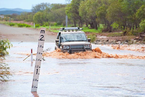 4WD crossing flooded road stock photo