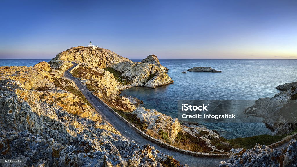 Sunrise on Isula Rossa Panoramic view of sunrise on Isula Rossa (L'le-Rousse) on the island Corsica. Blue Stock Photo