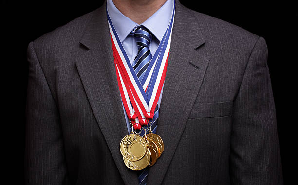 istock Man wearing suit jacket and gold medals 177400161